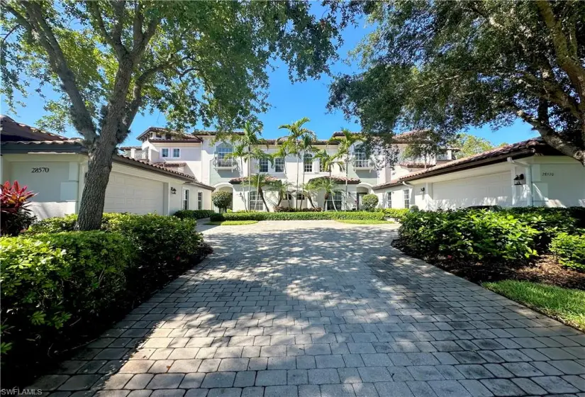 Mediterranean / spanish-style home with a garage