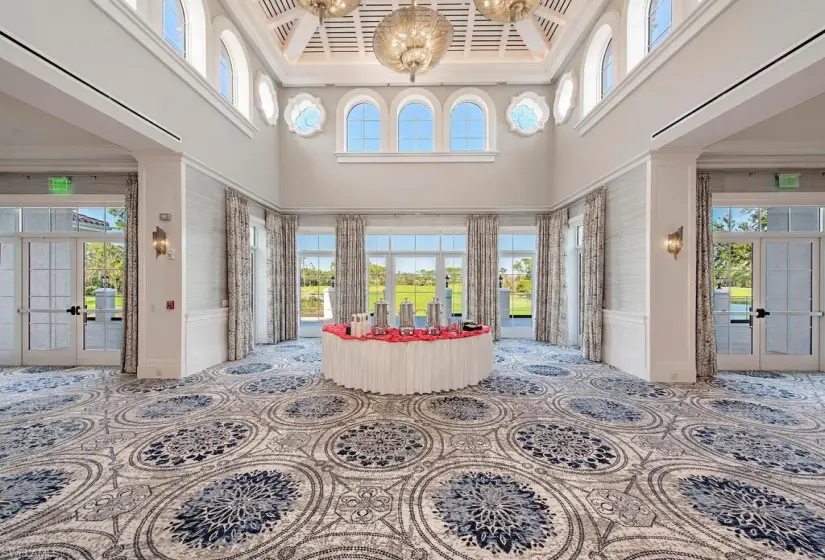 Sunroom featuring a tray ceiling and french doors