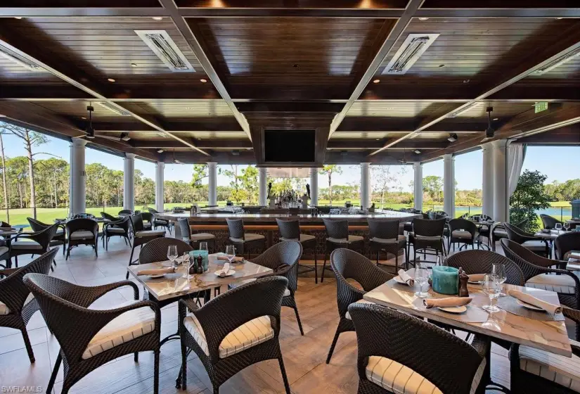 Dining space with a healthy amount of sunlight and wooden ceiling