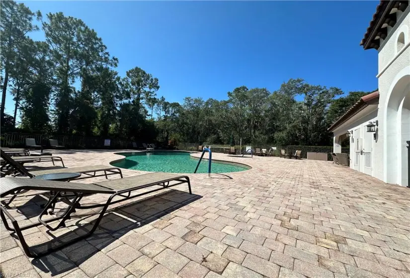 View of swimming pool with a patio area