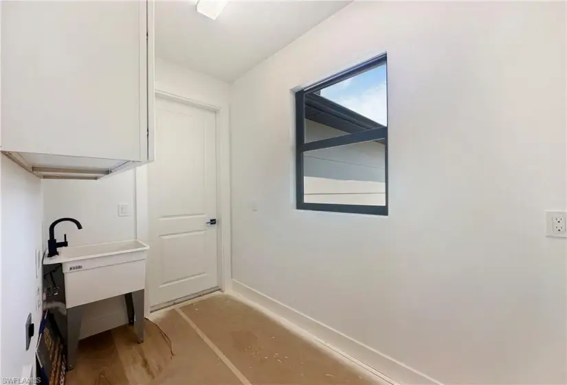 Laundry area with sink