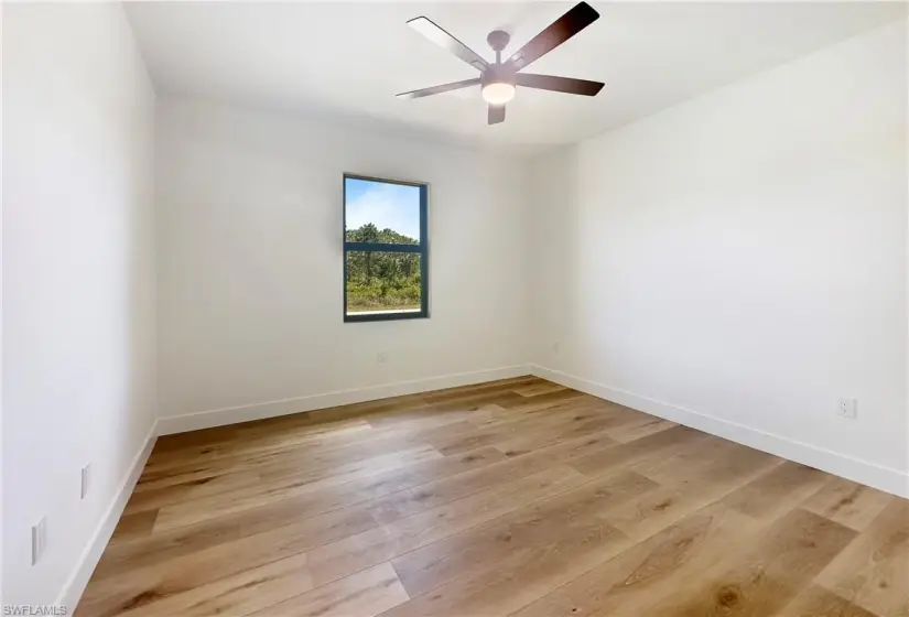 bedroom featuring ceiling fan and light wood-type flooring