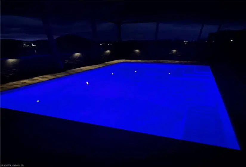 View of pool at twilight