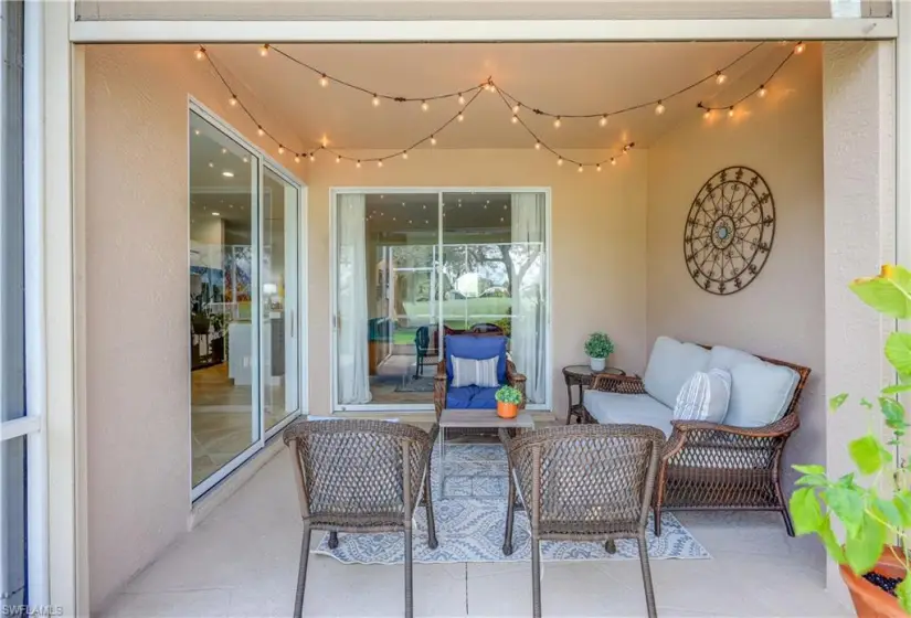 Back covered screen lanai over looking golf course